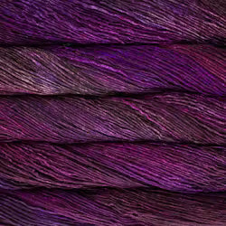 A close-up of twisted yarn strands in a heathered purple and magenta colorway, showing the texture and sheen of the fiber.