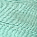 A close-up of mint green yarn strands wound tightly together.