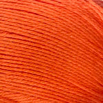 A close-up of bright orange yarn wound tightly together, filling the entire frame.