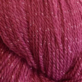 A close-up of twisted yarn in a heathered berry purple color with subtle pink and magenta undertones.