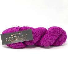 A skein of bright magenta-purple yarn with a black paper label reading 'ELETRA LITE' on a clean white background.