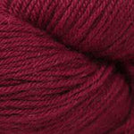 A close-up of deep burgundy or maroon yarn, showing the twisted plies and soft texture of the fiber.