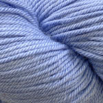A close-up of light periwinkle blue yarn wound into a skein.