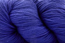 A close-up of a skein of vibrant royal blue yarn, showing the twisted plies and soft texture of the fiber.