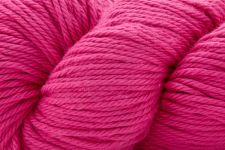 A close-up of bright pink yarn wound into a skein, filling the entire frame.