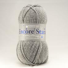 A skein of gray yarn with a white paper label reading 'Encore Star' and 'Bouclé Yarn', photographed against a light gray background.