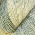 Close-up of soft yarn in a pale sage green and cream colorway.