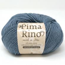 A ball of Pima Rino yarn in a dusty slate blue color, featuring a beige paper label with the brand name 'Pima Rino' printed on it, set against a plain white background.