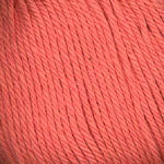 A close-up of coral pink yarn texture, showing the twisted strands and color detail.