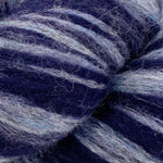 A close-up of textured yarn with horizontal stripes in deep navy blue and light periwinkle blue.