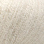 Close-up of light gray hair color swatch
