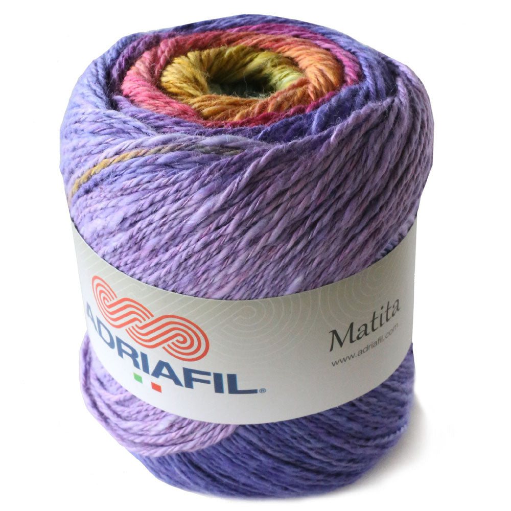 A ball of variegated yarn wrapped with a white paper label reading 'DORIAFIL Matila', shown on a clean white background.