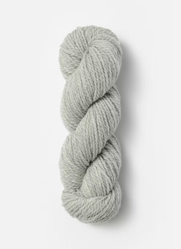 Gray skein of yarn on a white background