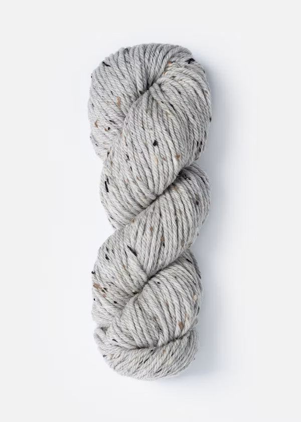 Gray skein of yarn on a white background
