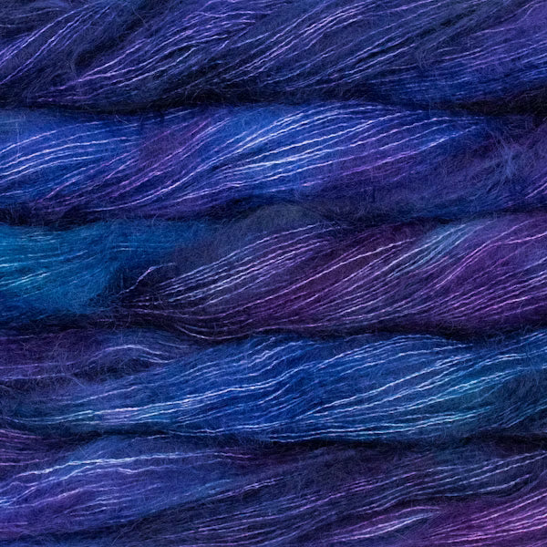 Close-up of blue and purple yarn strands