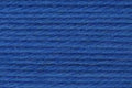 A close-up texture shot of a vibrant royal blue yarn or thread, showing the fine twisted strands and subtle sheen.