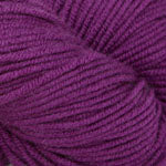 Purple yarn ball on a white background