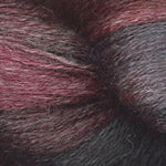 A close-up of a dark heathered yarn blend with maroon, charcoal gray, and black tones.