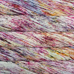 Close-up of a multicolor variegated yarn or fiber bundle with strands of cream, pink, purple, orange, and blue mixed throughout.