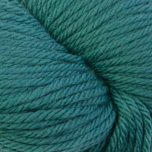 A close-up of teal blue-green yarn wound into a skein, filling the entire frame.