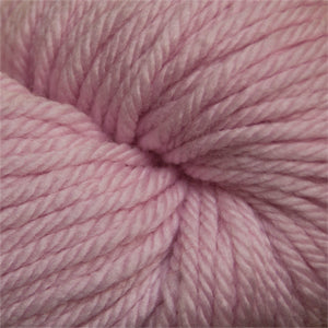 A close-up of a dusty light pink plied yarn skein, showing the texture of the twisted fibers.