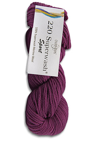 Purple skein of yarn with a label on a white background
