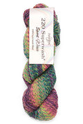Multicolored skein of yarn with a label on a white background