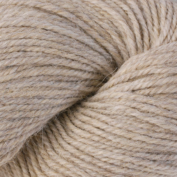 Close-up of beige yarn with a focus on texture