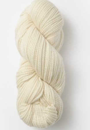 A single skein of cream-colored yarn twisted into a hank, shown against a plain light gray background.