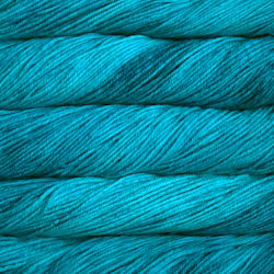 A close-up of teal blue yarn wound into skeins, showing the twisted plies and heathered texture of the fiber.