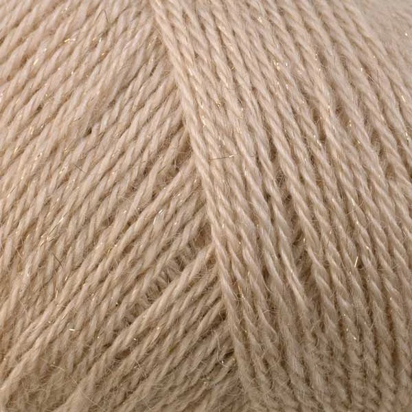 A close-up of light beige yarn with subtle shimmering fibers, filling the entire frame.