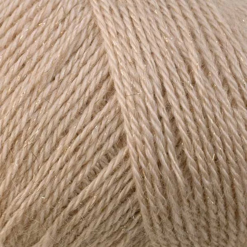 A close-up of light beige yarn with subtle shimmering fibers, filling the entire frame.