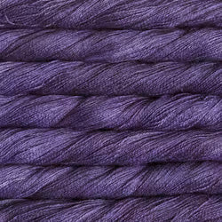 Close-up of purple yarn with a textured surface