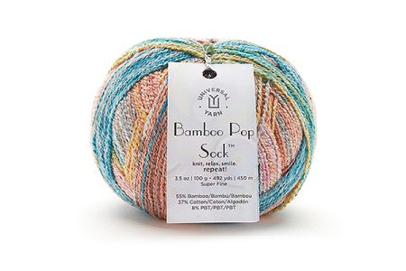 Multicolored skein of yarn with a label on a white background