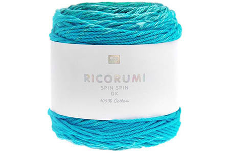 Turquoise yarn ball with a white label on a white background