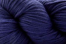 A close-up of a skein of yarn in a deep navy blue color, showing the twisted plies and soft texture of the fiber.