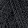 A close-up texture shot of dark charcoal gray twisted yarn, showing the fuzzy fibers and twisted plies.