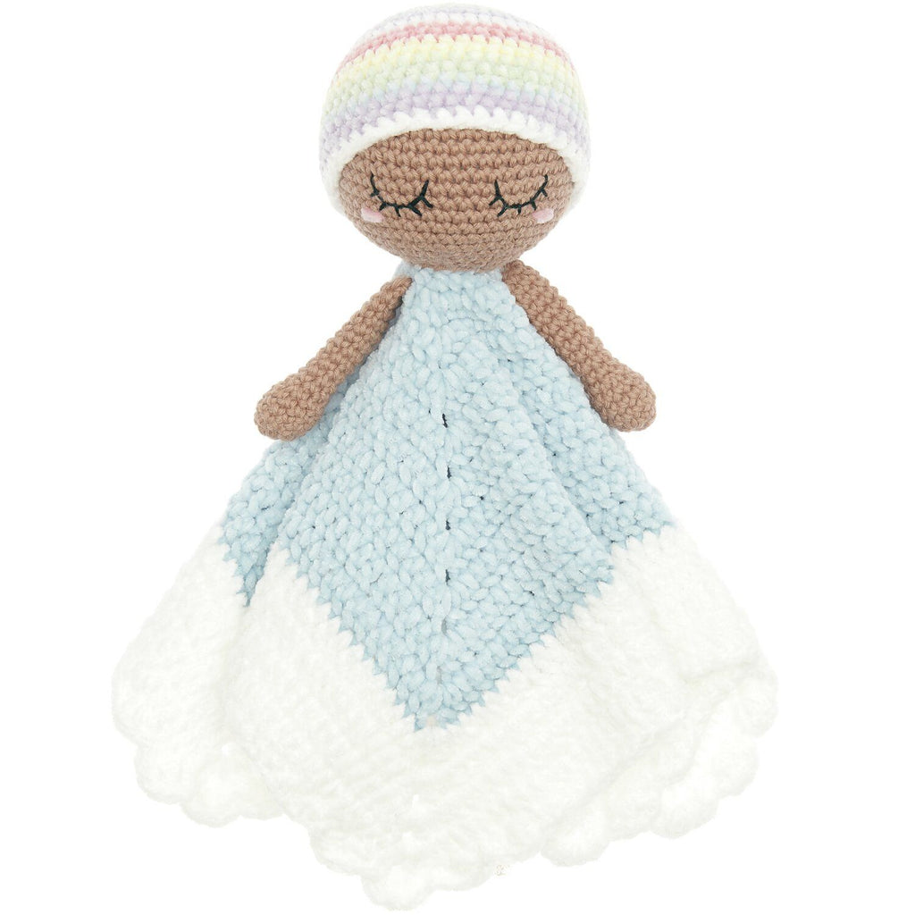 A handmade crocheted comforter doll with a pastel rainbow-striped hat, brown yarn skin and arms, and a light blue and white blanket.