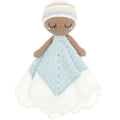 A handmade crocheted comforter doll with a pastel rainbow-striped hat, brown yarn skin and arms, and a light blue and white blanket.