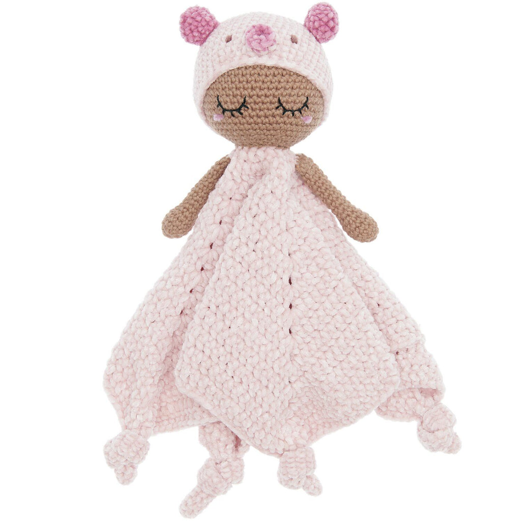 Knitted toy with pink dress and bear ears on a white background