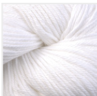 A close-up of white yarn wound into a skein, filling the frame.