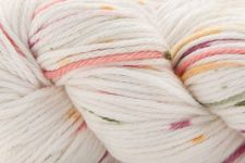 Close-up of a skein of variegated yarn with white as the dominant color and soft pastel stripes in pink, orange, yellow, and green.