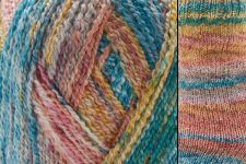 Close-up of multicolored yarn and knitted fabric with a pattern.