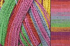 Close-up of a multicolored striped knit fabric or scarf with bands of pink, green, yellow, orange, purple, and blue.