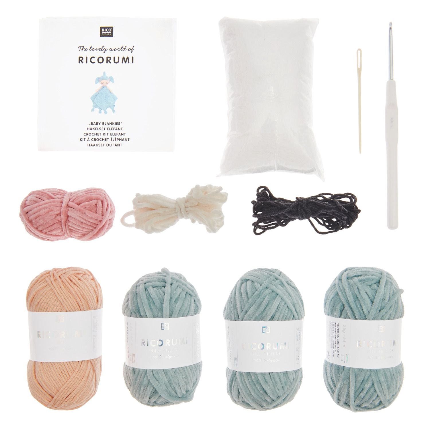 Crochet kit with yarn, a pillow, and a crochet hook on a white background