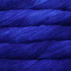 A close-up of tightly wound yarn or thread in a saturated royal blue color, filling the entire frame.