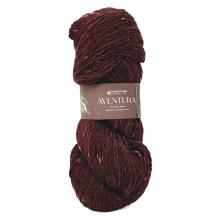Ball of dark red yarn with a label on a white background