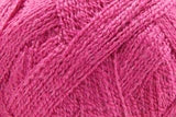 A close-up of bright pink yarn strands twisted together, filling the entire frame.