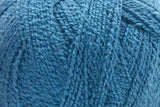 A close-up of a ball of blue yarn showing the texture of the twisted fibers.