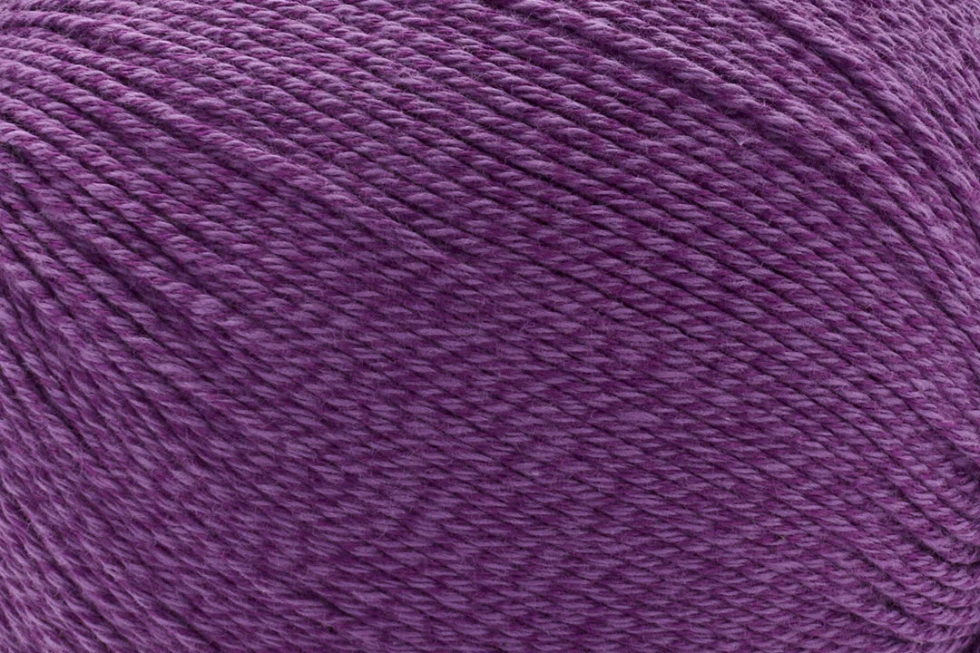A close-up texture shot of a purple plied yarn or thread filling the entire frame.